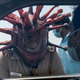 Police inspector Rajesh Babu wearing coronavirus-themed helmet speaks to a motorist at a checkpoint in Chennai on March 28, 2020.